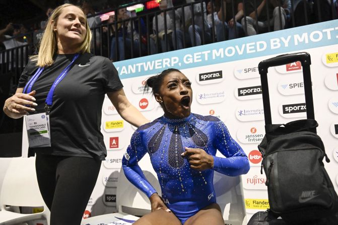 Biles celebrates after winning the individual all-around at the World Artistic Gymnastics Championships in October 2023. <a href="https://www.cnn.com/2023/10/06/sport/simone-biles-history-world-championships-spt-intl/index.html" target="_blank">By winning gold</a>, she became the most decorated female or male gymnast ever, surpassing Belarusian Vitaly Scherbo's record of 33 overall medals across both the Olympics and the world championships.