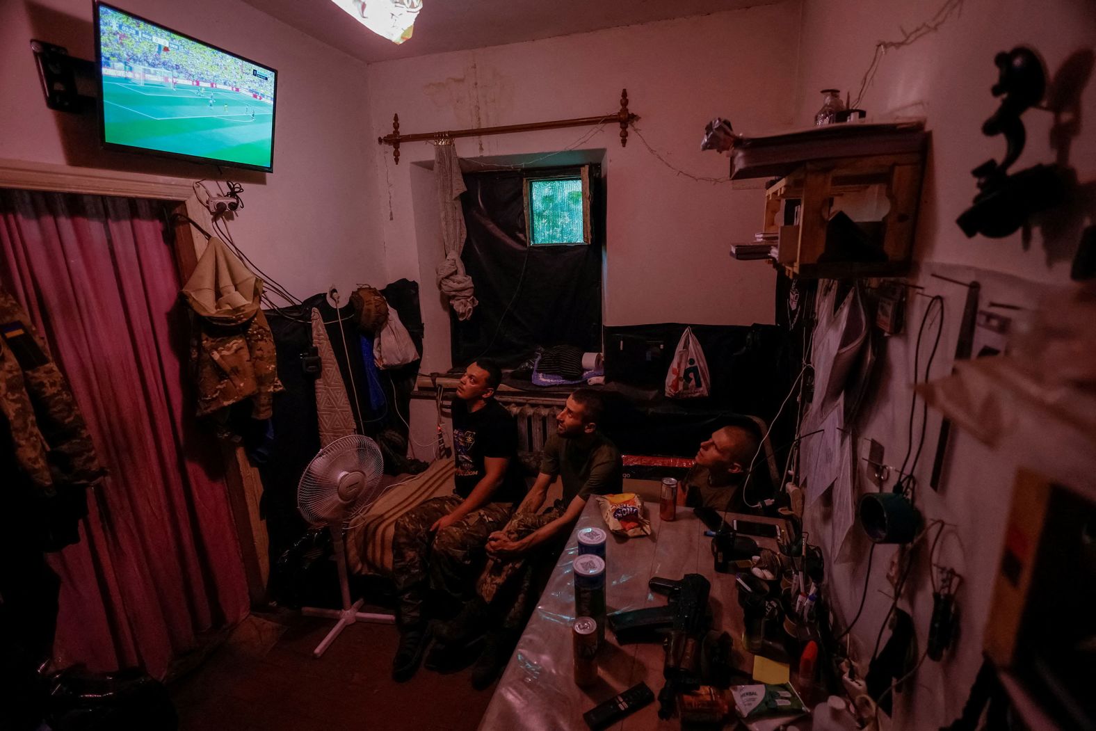 Ukrainian service members watch the Euro 2024 match between Romania and Ukraine near the front lines of their war with Russia on Monday, June 17.