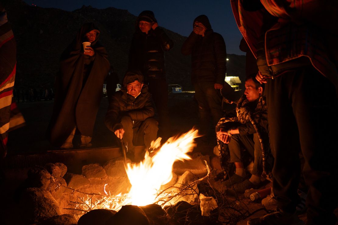 A group of Chinese migrants gathered at a temporary camp near the US-Mexican border after illegally crossing into the US.