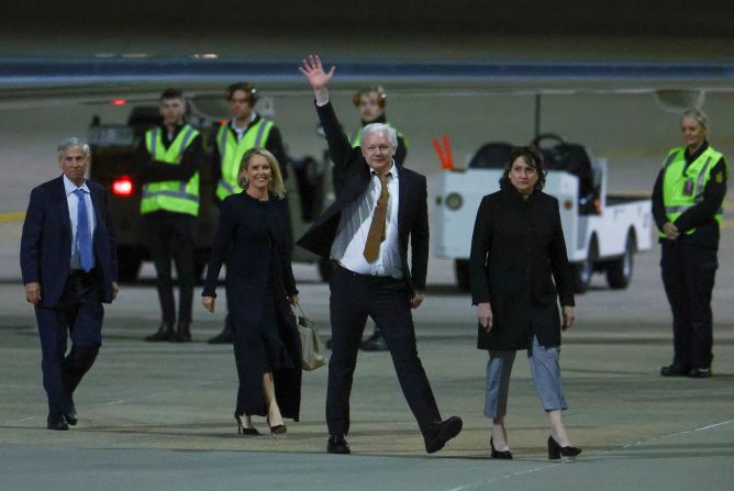 WikiLeaks founder Julian Assange waves as he arrives in Australia on June 26.