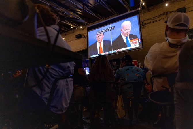 People watch the debate in Washington, DC.