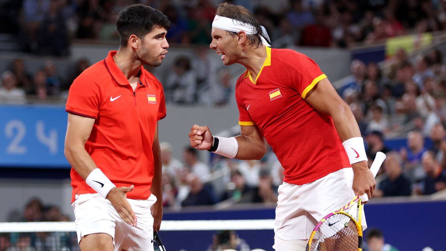 PARIS, FRANCE - JULY 27: Rafael Nadal (R) and partner Carlos Alcaraz of Team Spain celebrate against Andres Molteni and Maximo Gonzalez of Team Argentina during the Men's Doubles first round match on day one of the Olympic Games Paris 2024 at Roland Garros on July 27, 2024 in Paris, France. (Photo by Clive Brunskill/Getty Images)