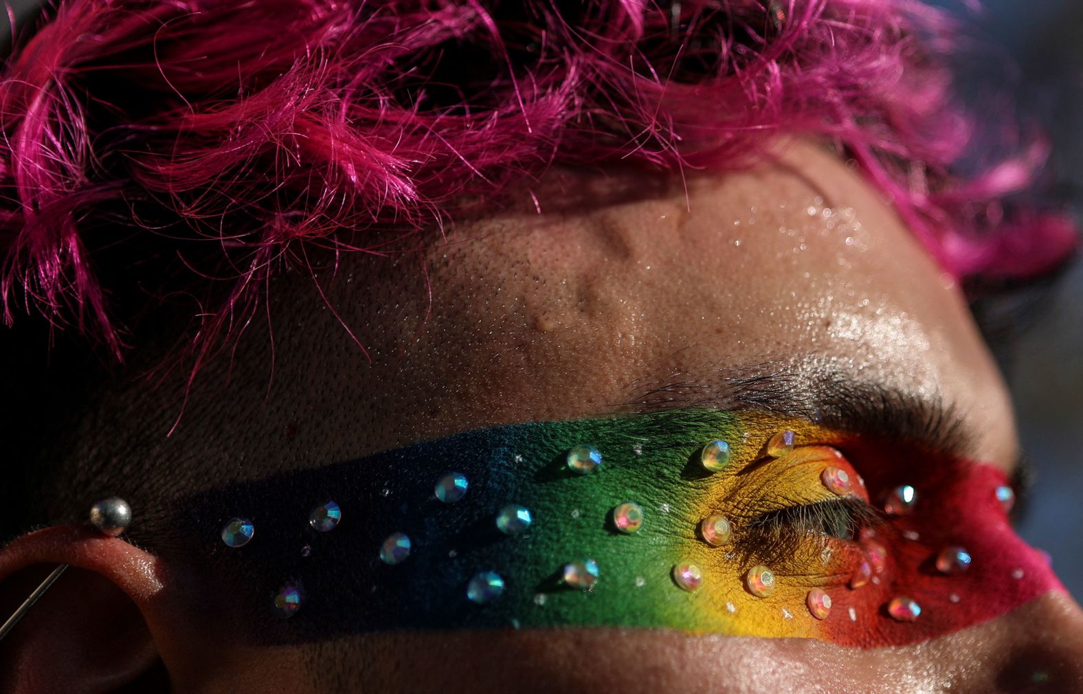 A reveler wears rainbow-colored makeup during the Pride March in Ciudad Juárez, Mexico, on Sunday, June 16.