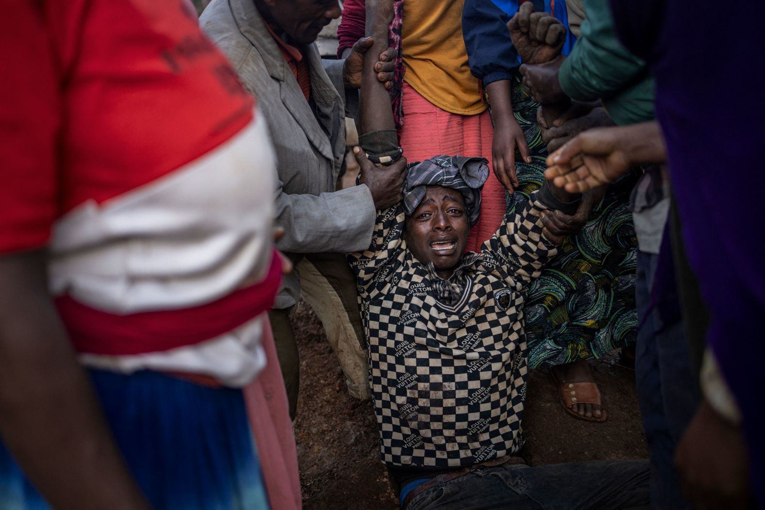 A woman is comforted by relatives and friends at the scene of a landslide in south Ethiopia’s Gofa Zone on Wednesday, July 24. <a href="https://www.cnn.com/2024/07/25/africa/ethiopia-landslide-deaths-reach-257-intl/index.html">Devastating landslides have killed more than 250 people</a>, according to the United Nations.