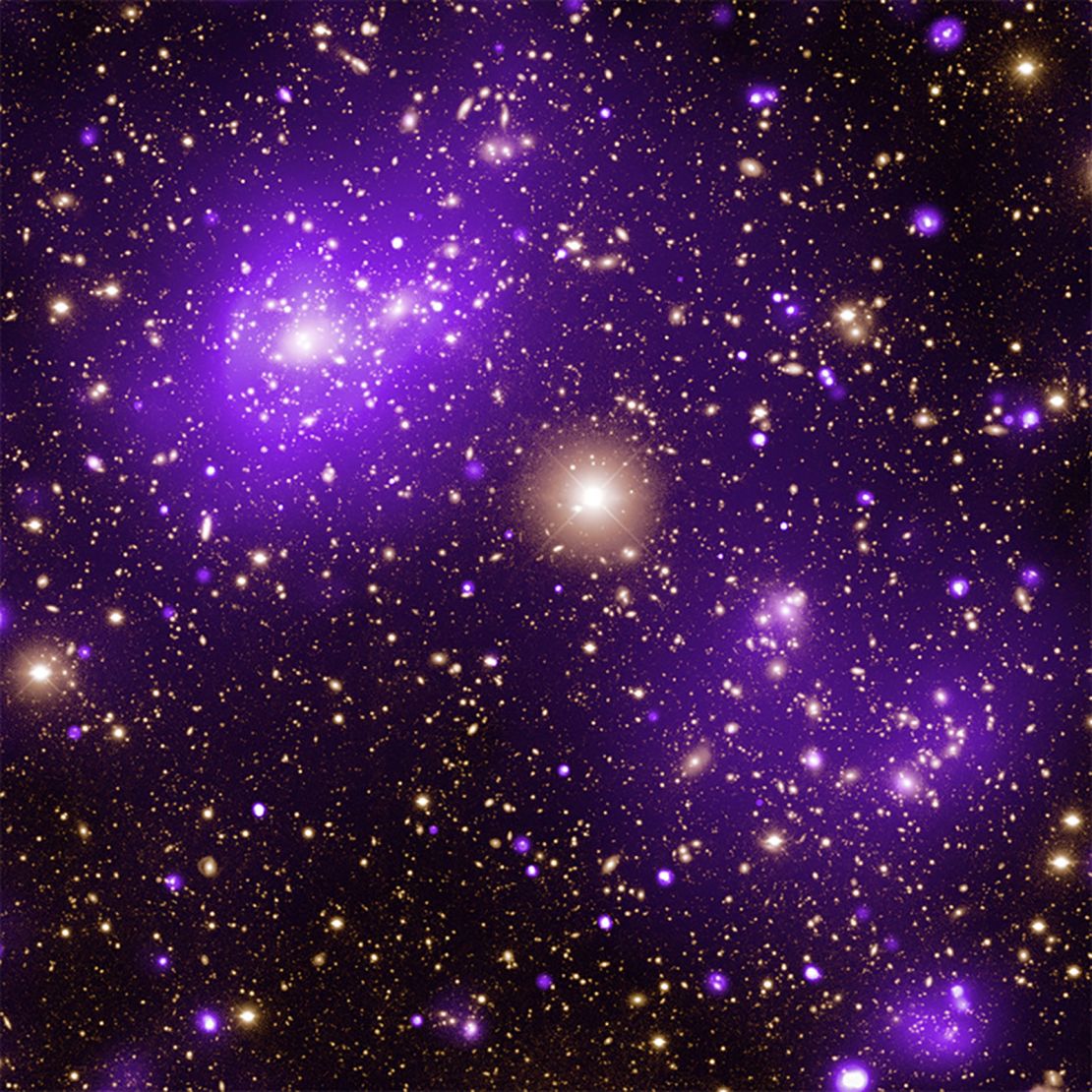 Neon purple gas clouds imaged by Chandra in X-ray light glow in an image of the Abell 2125 galaxy cluster.