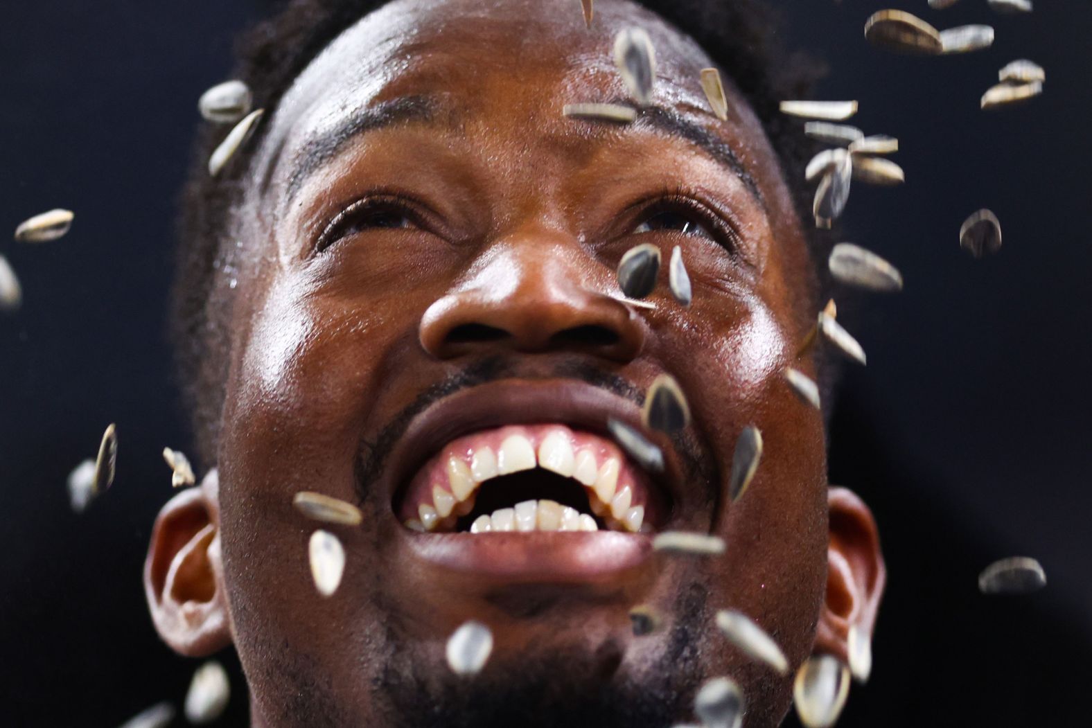 Miami Marlins outfielder Jesús Sánchez is showered with sunflower seeds by teammates after he hit a home run against Baltimore on Tuesday, July 23.