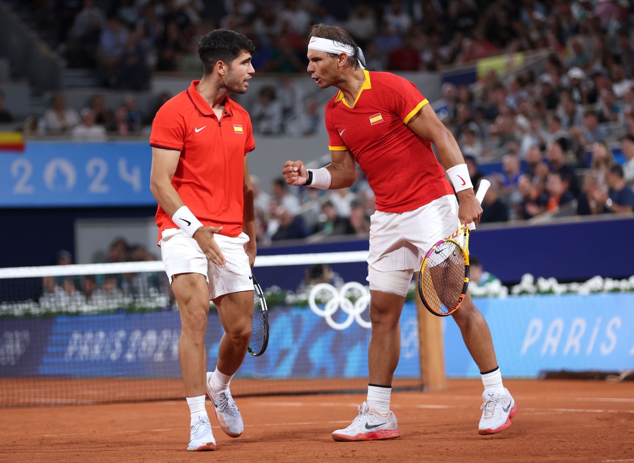 Spain's Rafael Nadal, right, and Carlos Alcaraz compete against Andres Molteni and Maximo Gonzalez of Argentina during a men's doubles first round match at Roland Garros in Paris on July 27. 