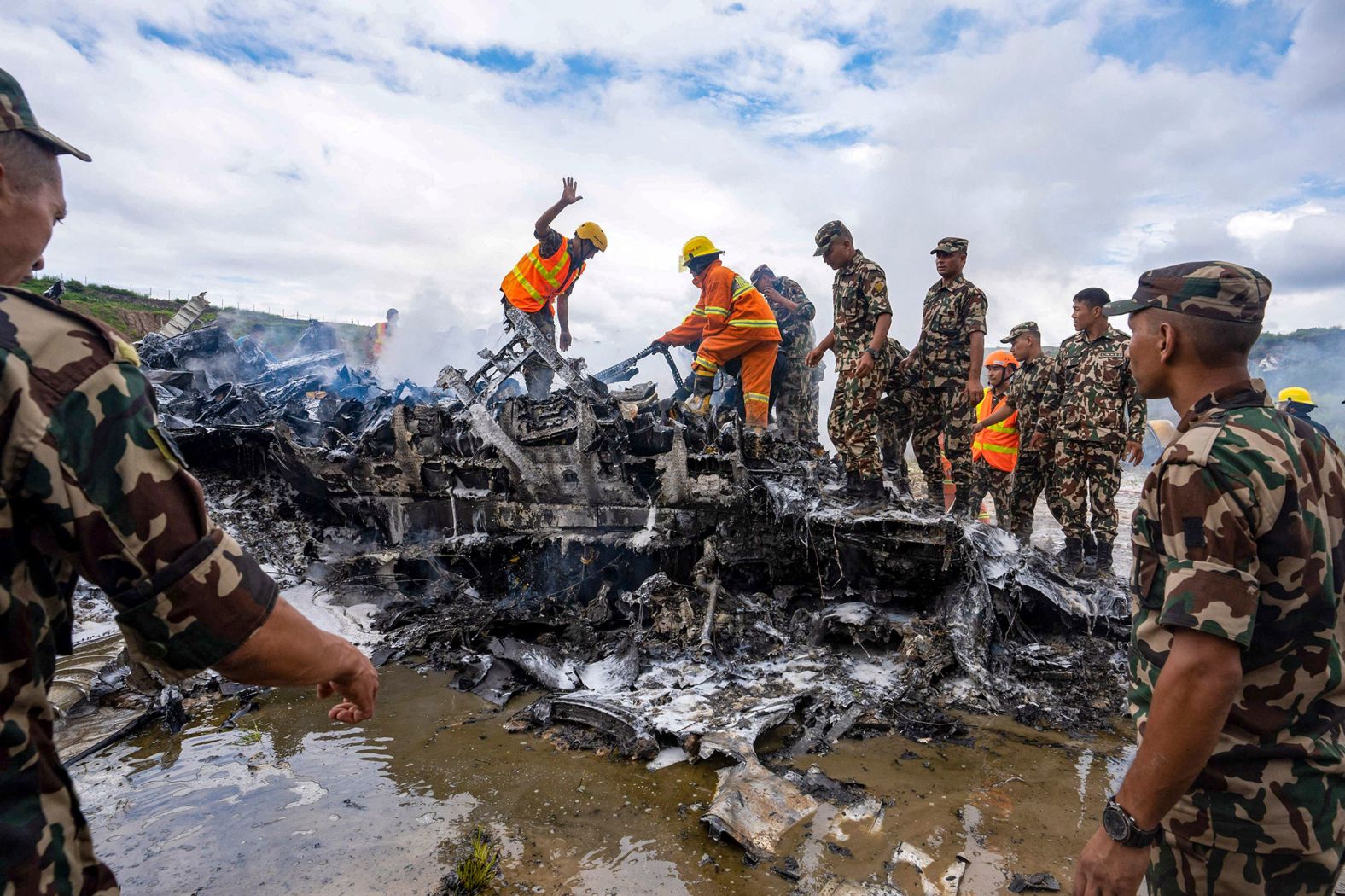 Army personnel sort through debris after a small plane <a href="https://www.cnn.com/2024/07/24/asia/nepal-saurya-airline-plane-crash-intl-hnk/index.html">crashed during takeoff</a> in Kathmandu, Nepal, on Wednesday, July 24. At least 18 people were killed after the Saurya Airlines plane skidded off the runway. The pilot was the only survivor. <a href="https://www.cnn.com/2024/07/19/world/gallery/the-week-in-40-photos/index.html">See last week in 40 photos</a>.