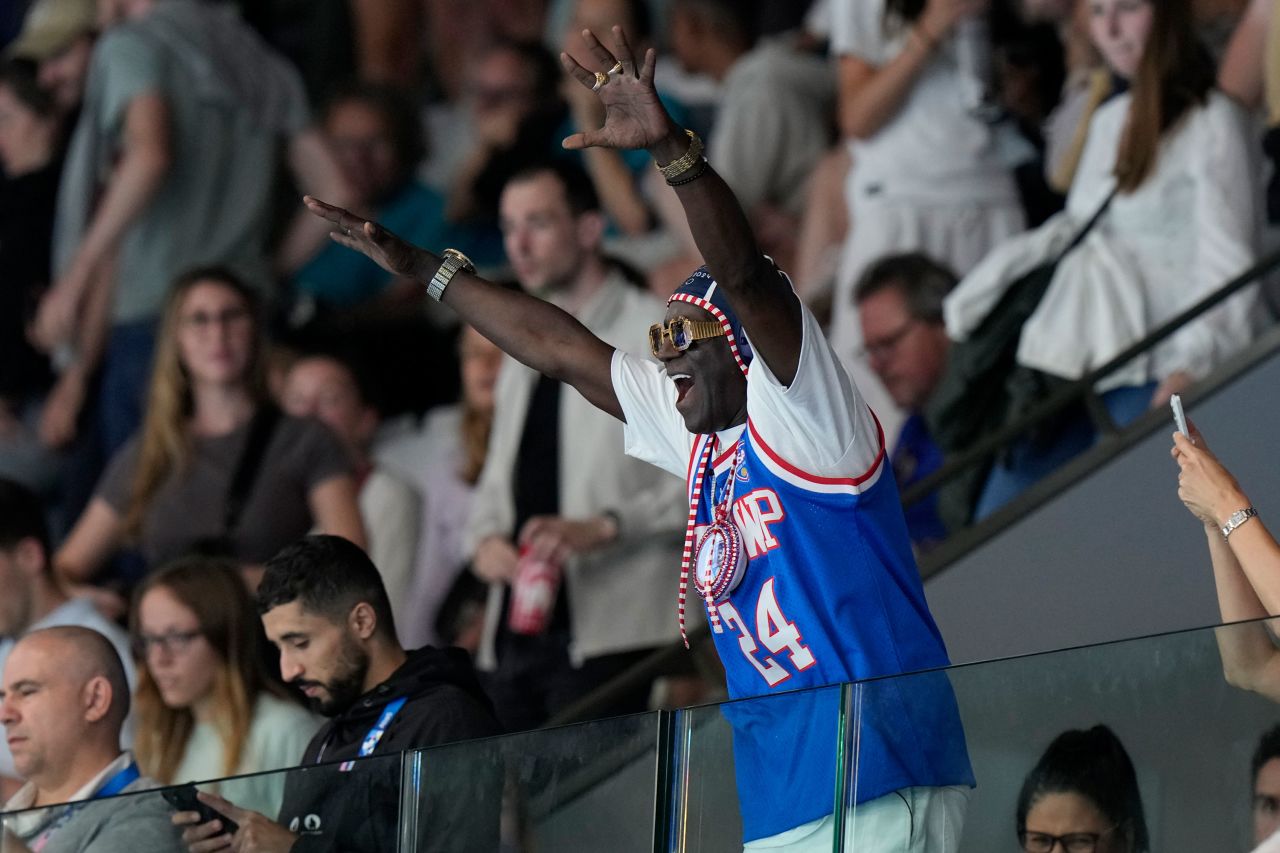 Flavor Flav celebrates after a US women's water polo match against Greece in Saint-Denis, France, on July 27. 