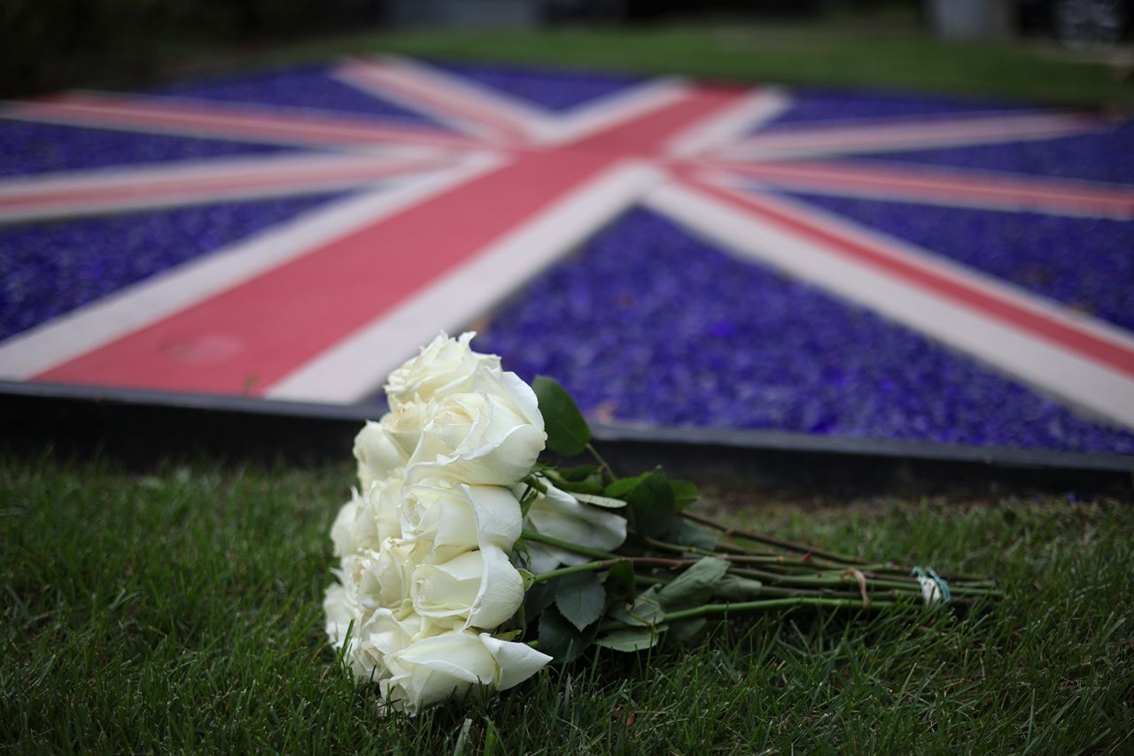 Roses are laid outside the British Embassy after the death of Queen Elizabeth was announced on Thursday, in Washington, DC.