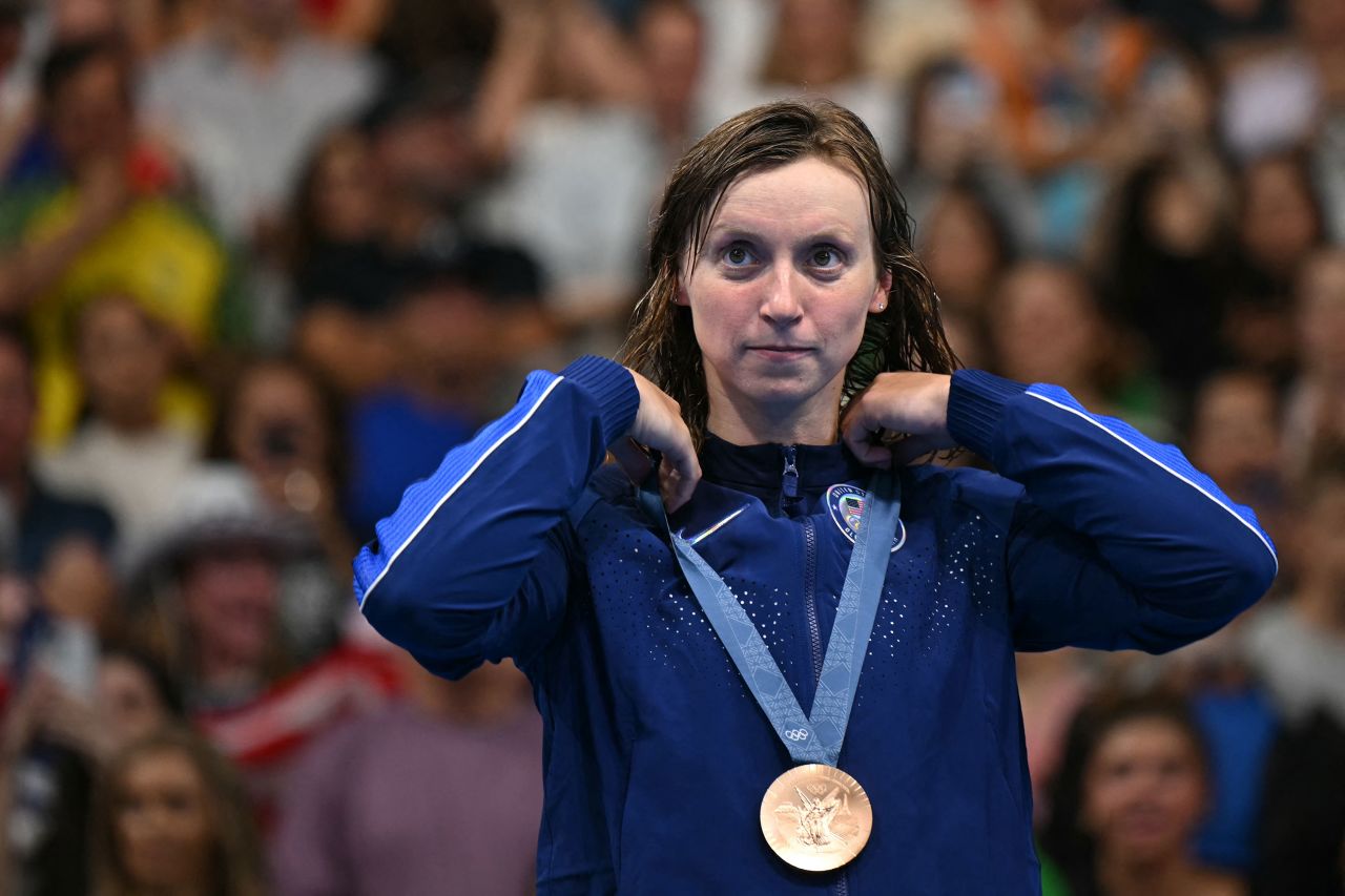 Katie Ledecky stands on the podium after winning the bronze medal in the women's 400-meter freestyle race at La Défense Arena in Nanterre, France, on July 27. 