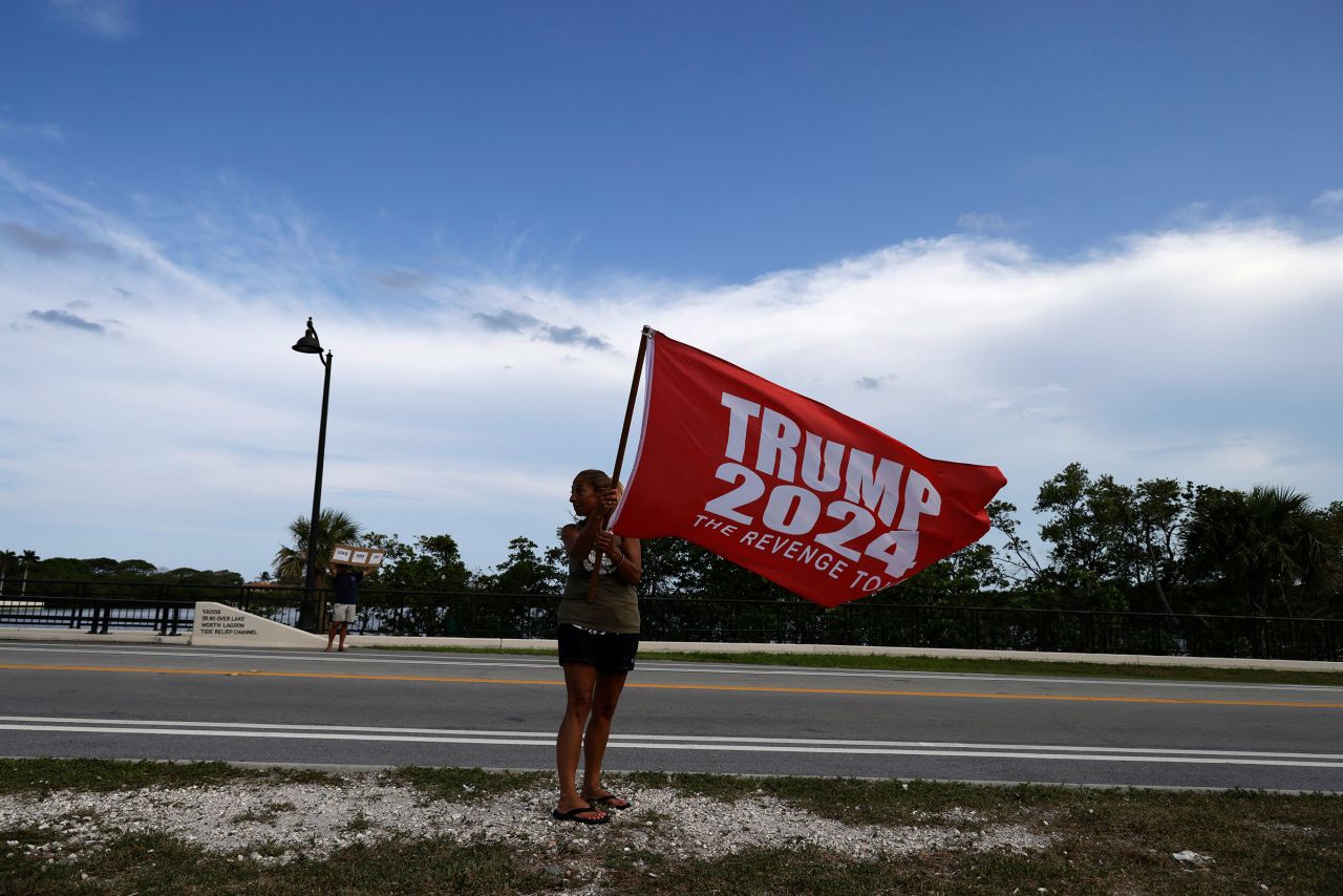 A supporter of former President Donald Trump joins a small gathering near Mar-a-Lago on May 30 in Palm Beach, Florida. 