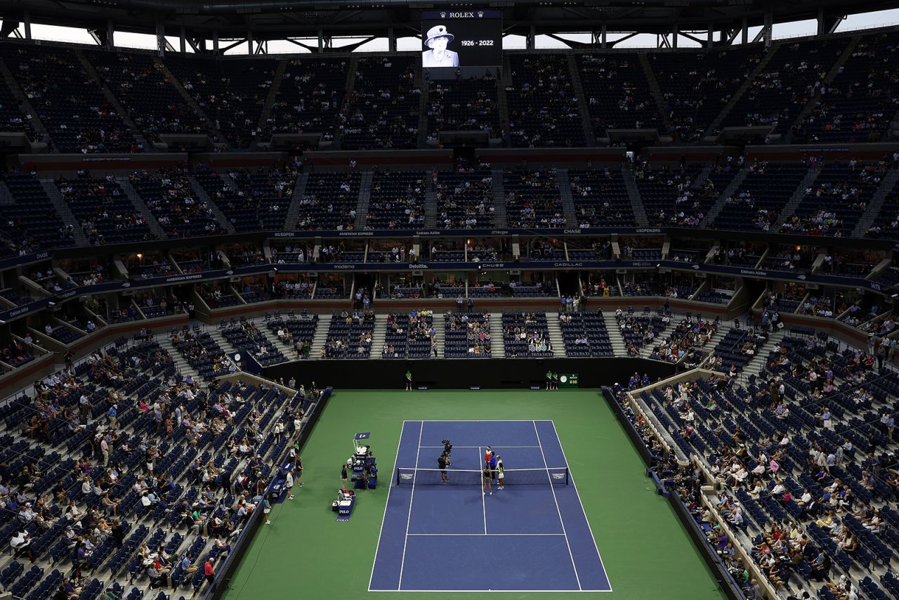 Ons Jabeur of Tunisia and Caroline Garcia of France stand on court for a moment of silence for Queen Elizabeth prior to their Women’s Singles Semifinal match of the 2022 US Open in New York on September 08, 2022.