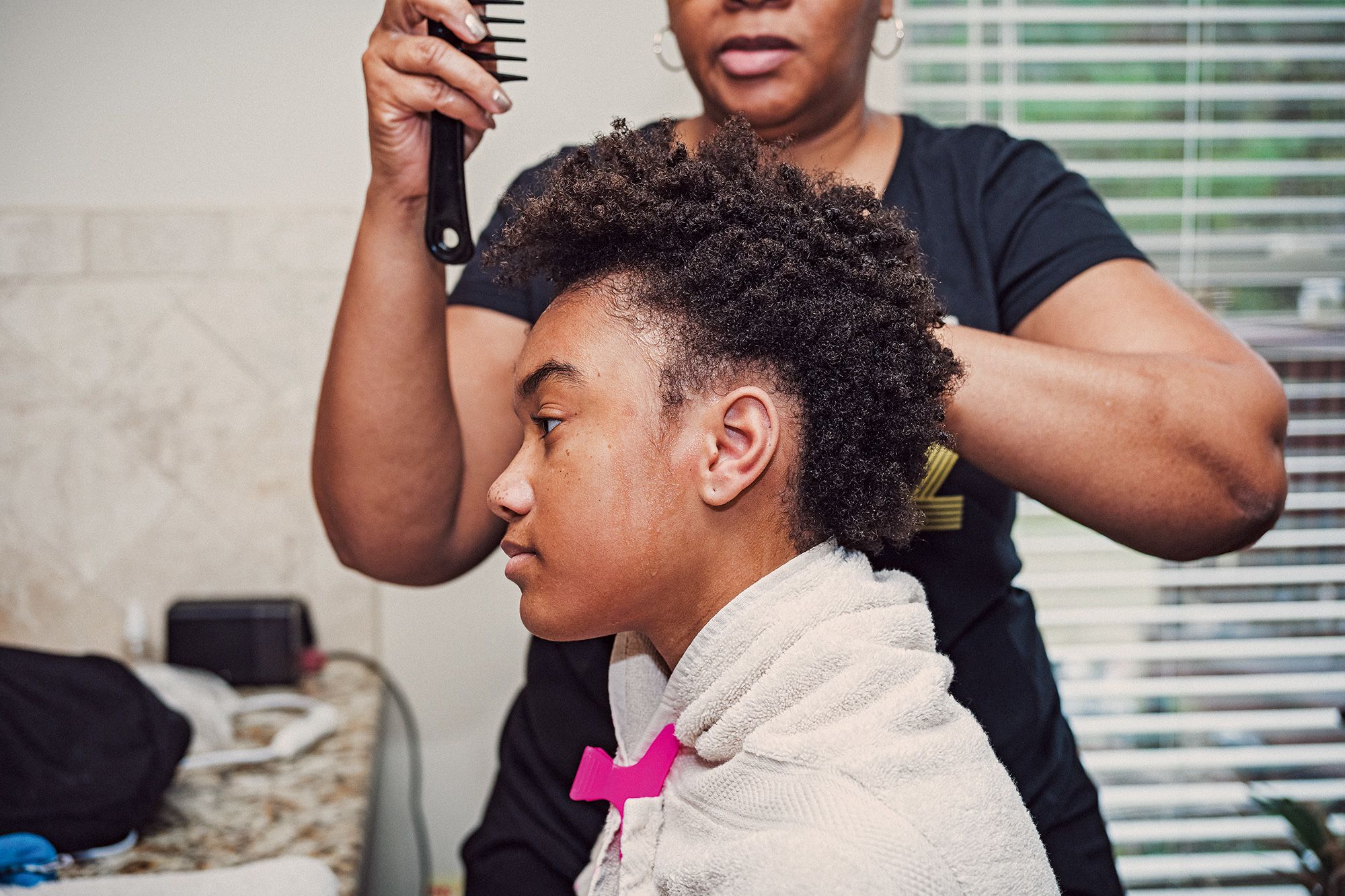 Trina's daughter Zoe enjoys wearing braids, so her mother taught herself how to weave them.