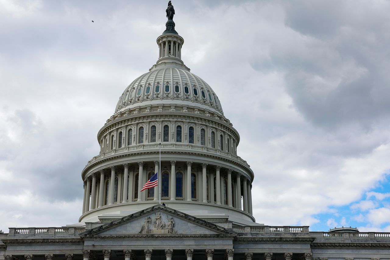 The flag above the U.S. Capitol is brought to half-staff on Thursday.