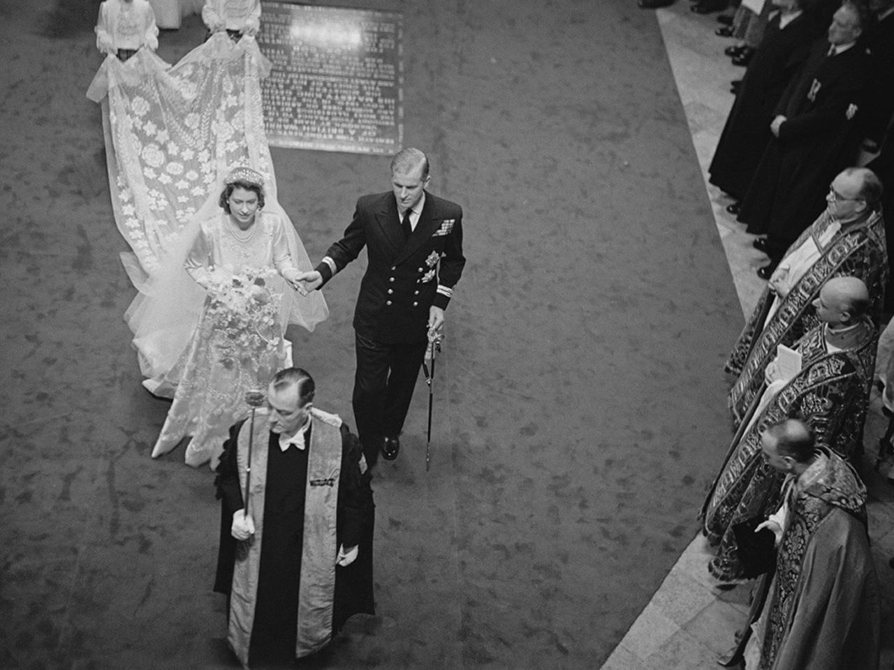 Elizabeth and Philip make their way down the aisle of Westminster Abbey on their wedding day, November 20, 1947.  