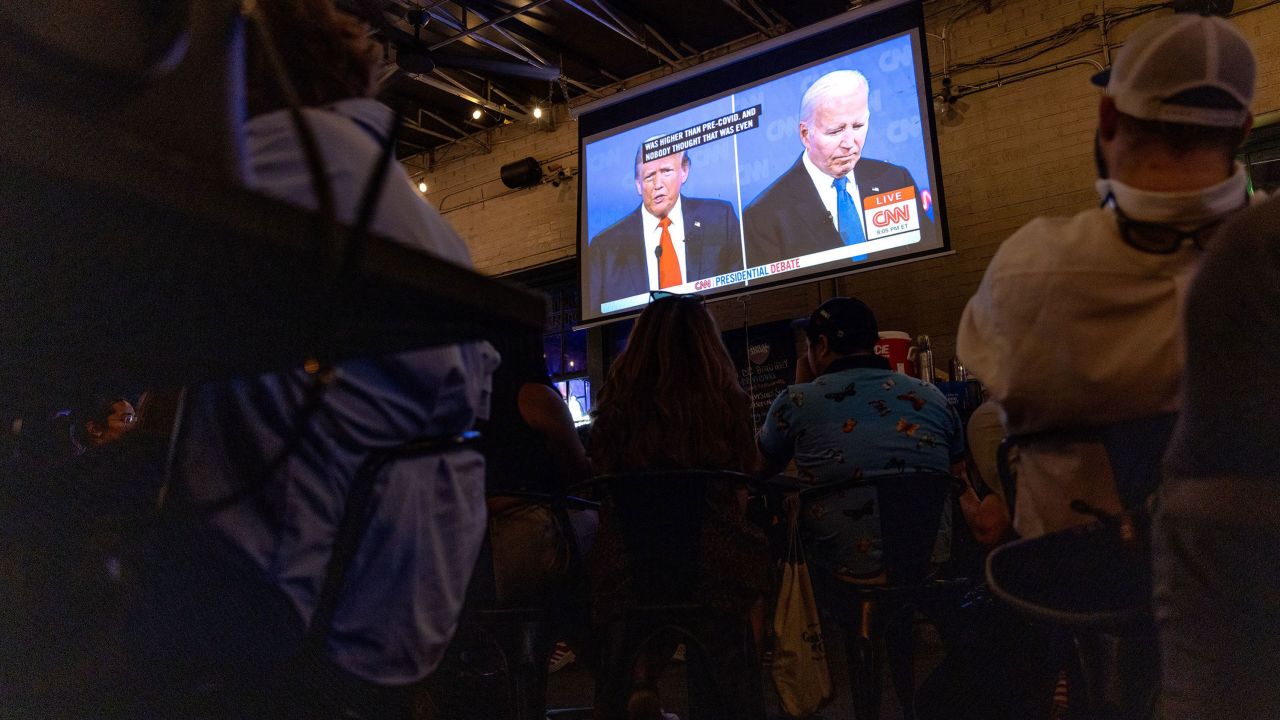 People watch the presidential debate during a watch party at Union Pub in Washington, DC, on Thursday. 