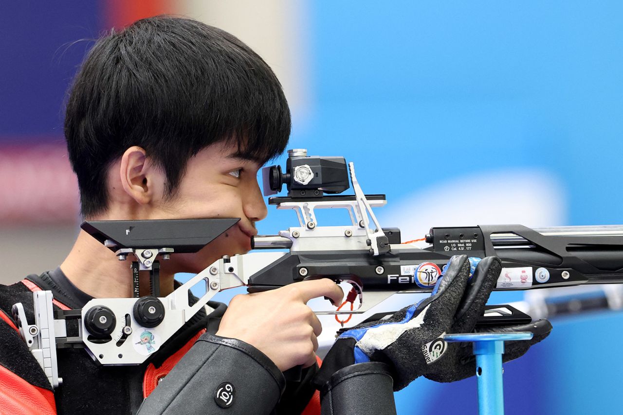 China's Sheng Lihao competes in the shooting 10m Air Rifle Mixed Team Gold Medal during the Paris 2024 Olympic Games at Chateauroux Shooting Centre on July 29.