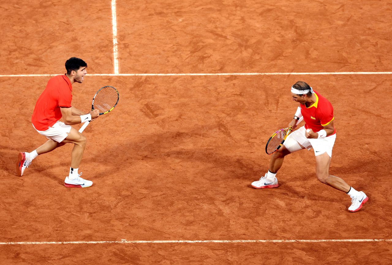 Spain's Carlos Alcaraz, left, and Rafael Nadal celebrate. 