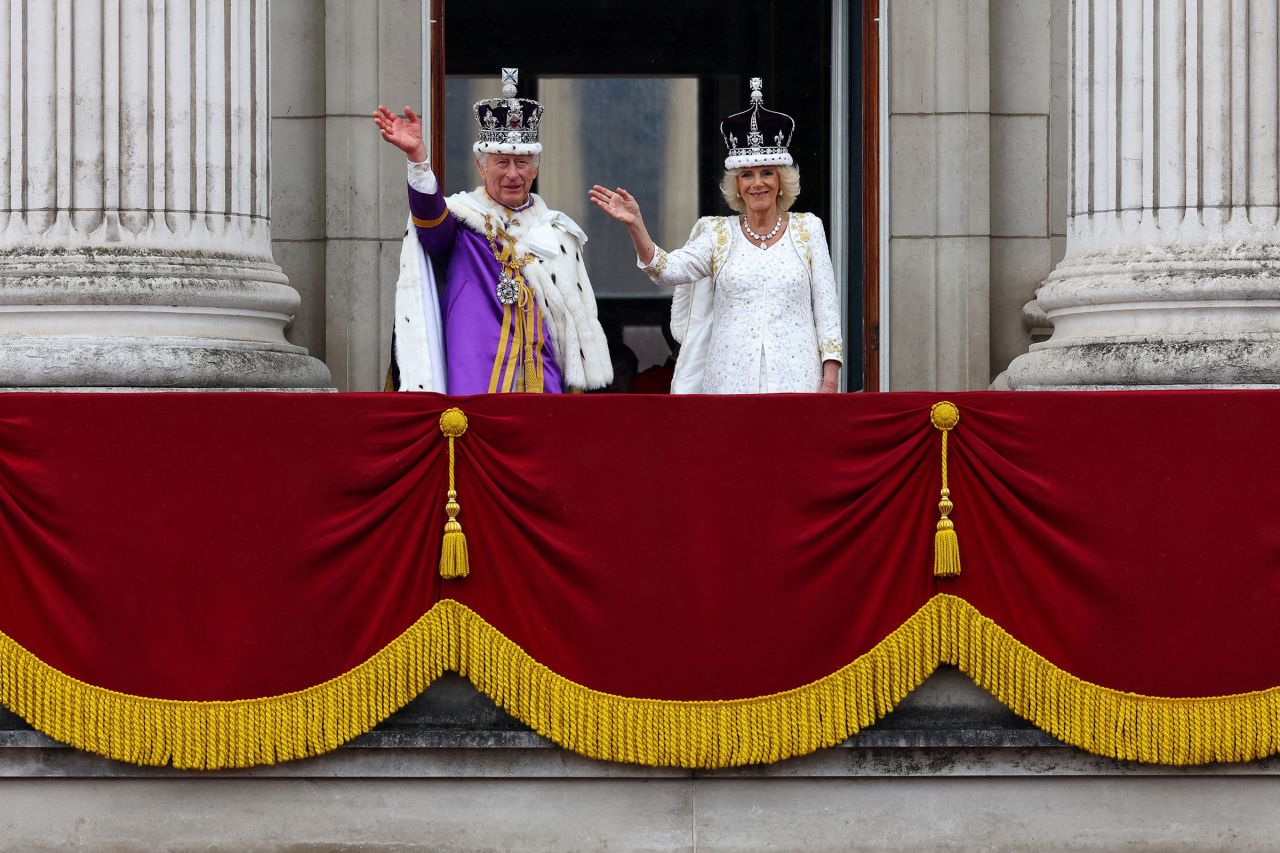 Britain's King Charles and Queen Camilla wave on the Buckingham Palace balcony.