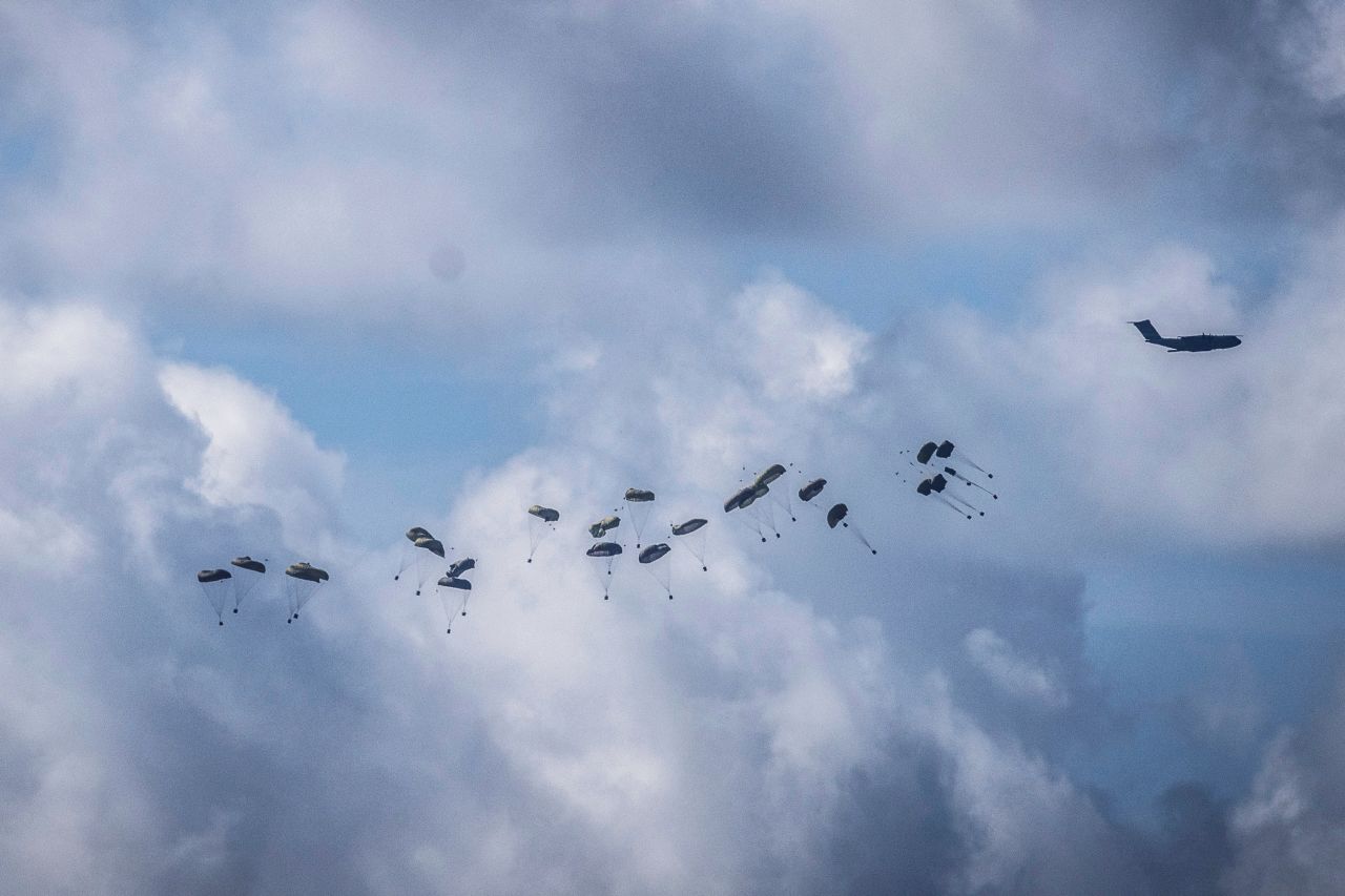 International airplanes, pictured from Sderot, Israel, airdrop aid for Gaza on March 7.