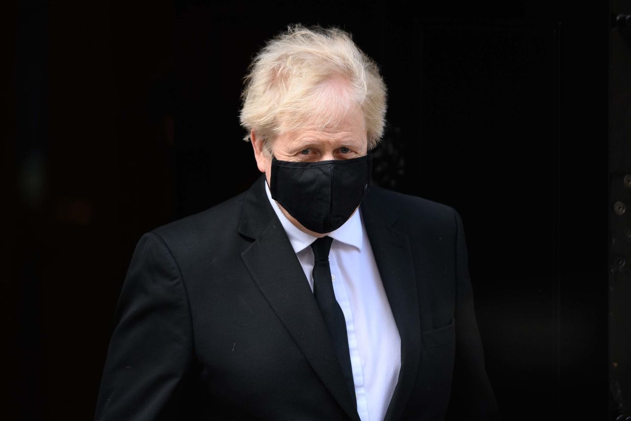 British Prime Minister Boris Johnson is pictured leaving 10 Downing Street in London, ahead of a tribute session in the House of Commons for Prince Philip, on April 12. 