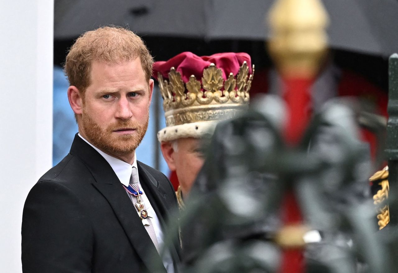 Britain's Prince Harry stands outside Westminster Abbey following Britain's King Charles' coronation ceremony.