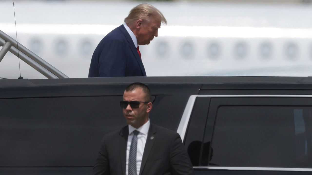 Former President Donald Trump arrives at Miami International Airport on Monday.