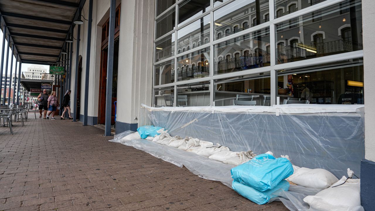 Businesses use sand bags to protect windows and entrances from Beryl in Galveston, Texas, on July 7. 