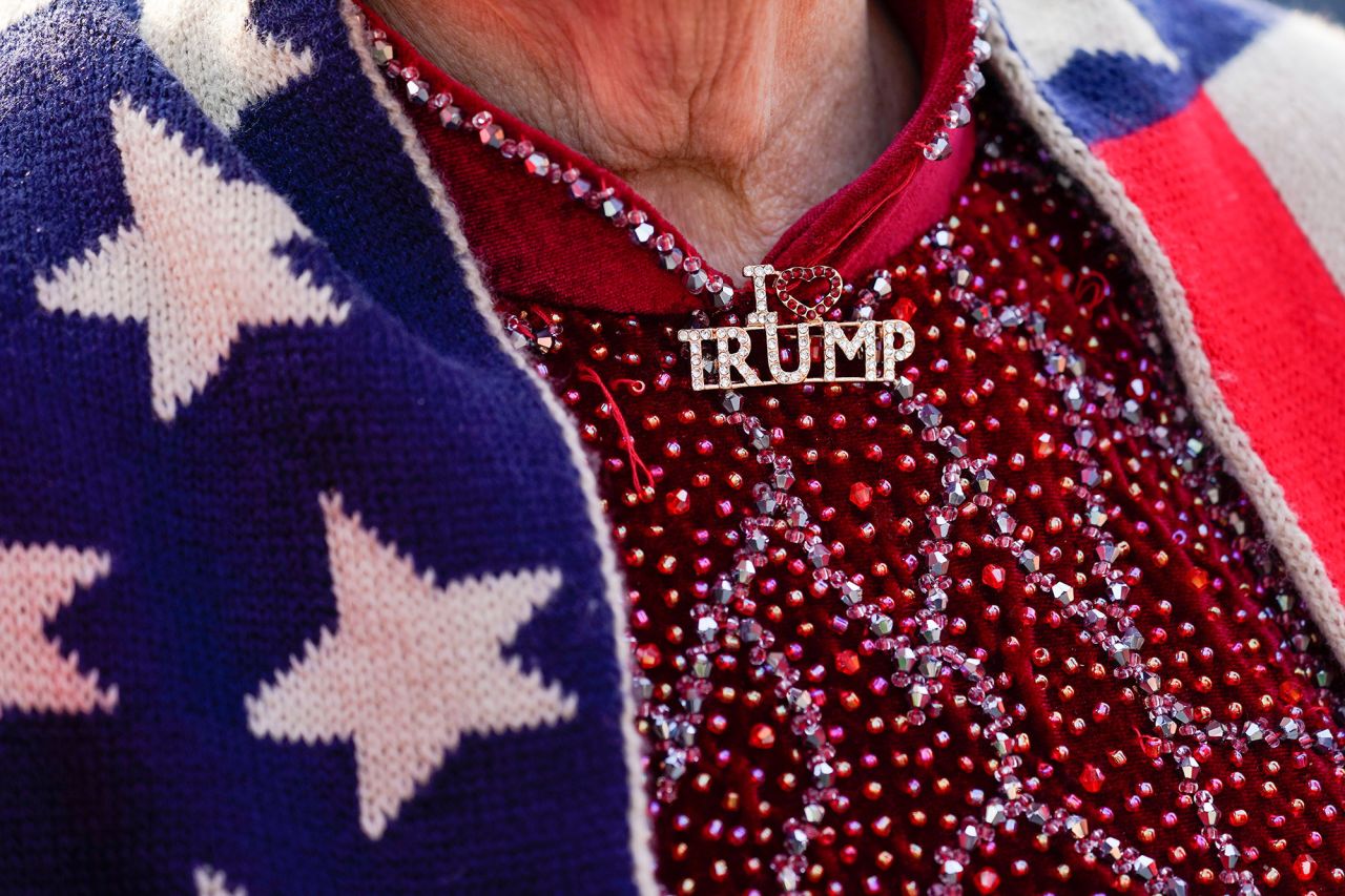 A supporter wears an "I Love Trump" pin while waiting for the former president to arrive in Bedminster on June 13, 2023. 