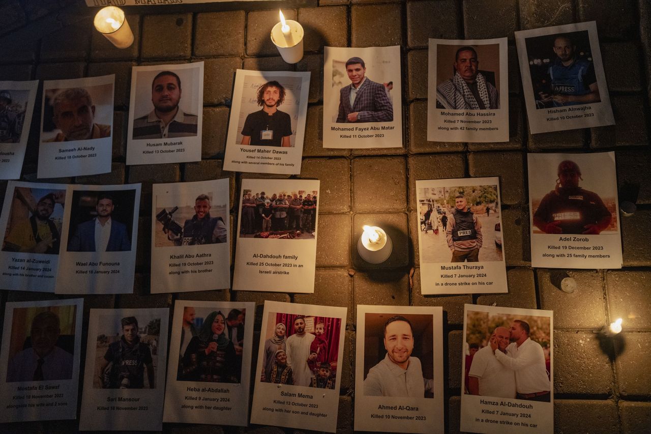 People gather to commemorate the journalists who lost their lives during the Israeli attacks on Gaza in Johannesburg, South Africa on January 28.