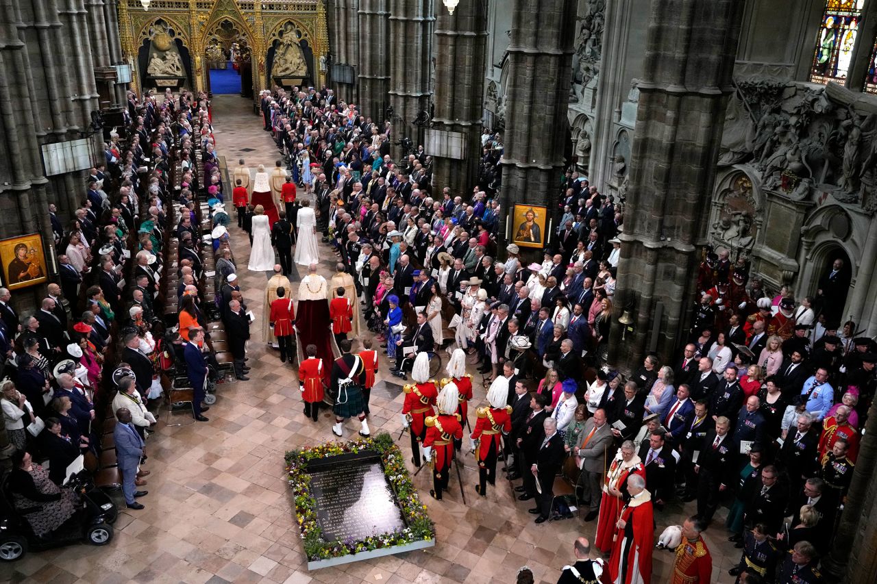 Britain's King Charles III, center, and Queen Camilla arrive for the coronation ceremony.