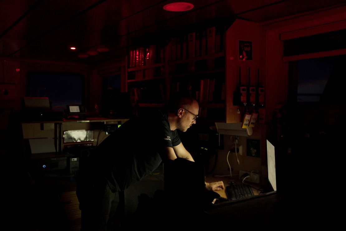 A Sea Shepherd Global communication officer works on the bridge of the Allankay in the Southern Ocean on the night of March 3, 2023. The conservation group operates the Dutch-flagged vessel.