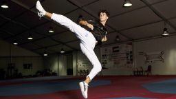 Omar Ismail, who was born in Dubai and will be competing for the Palestinian territories at the Paris Olympics, practices taekwondo in Sharjah, United Arab Emirates, on Thursday, June 20, 2024. (AP Photo/Martin Dokoupil)