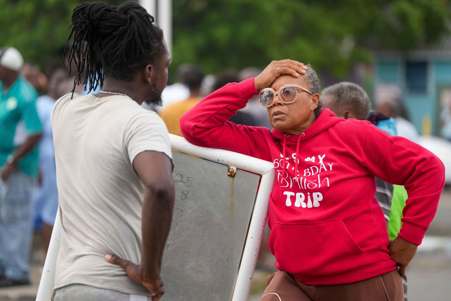 Sylvia Small waits to enter the Bridgetown Fisheries pier on Monday so she can check her boat's damage in Barbados.