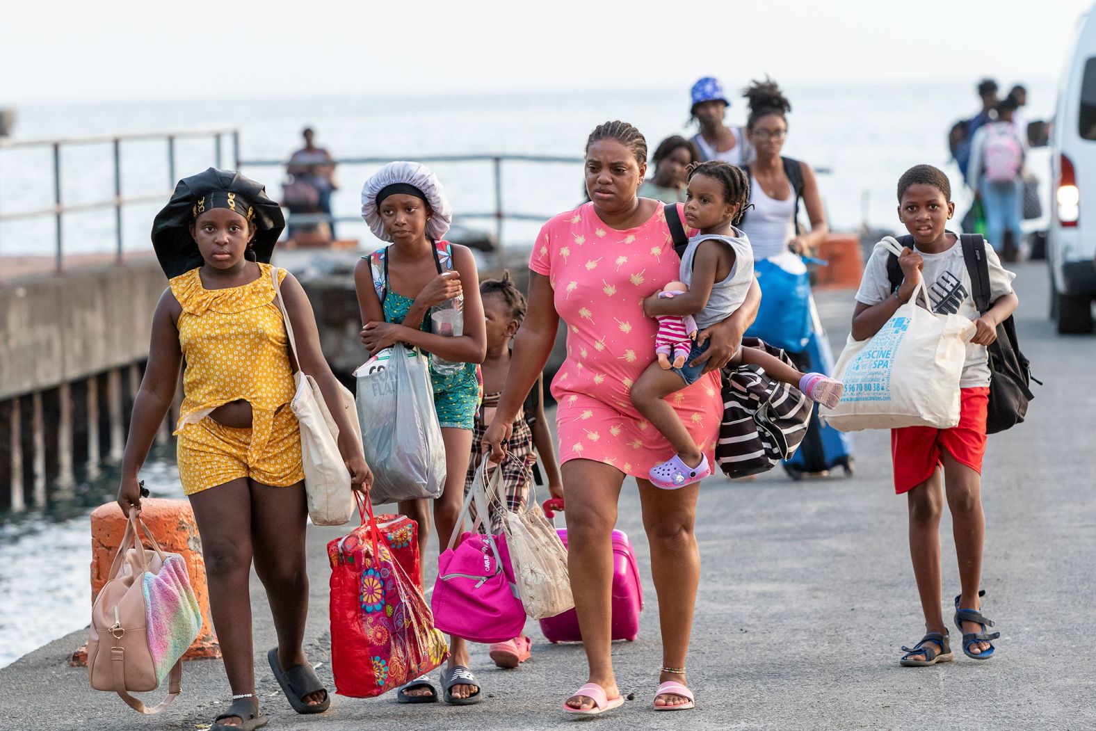 Evacuees from Union Island arrive Tuesday in Kingstown, St. Vincent and the Grenadines.