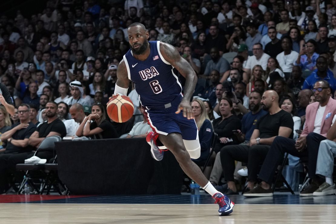 Team USA's LeBron James drives against Australia during the USA Basketball Showcase in Abu Dhabi, United Arab Emirates, Monday, July 15, 2024. (AP Photo/Altaf Qadri)