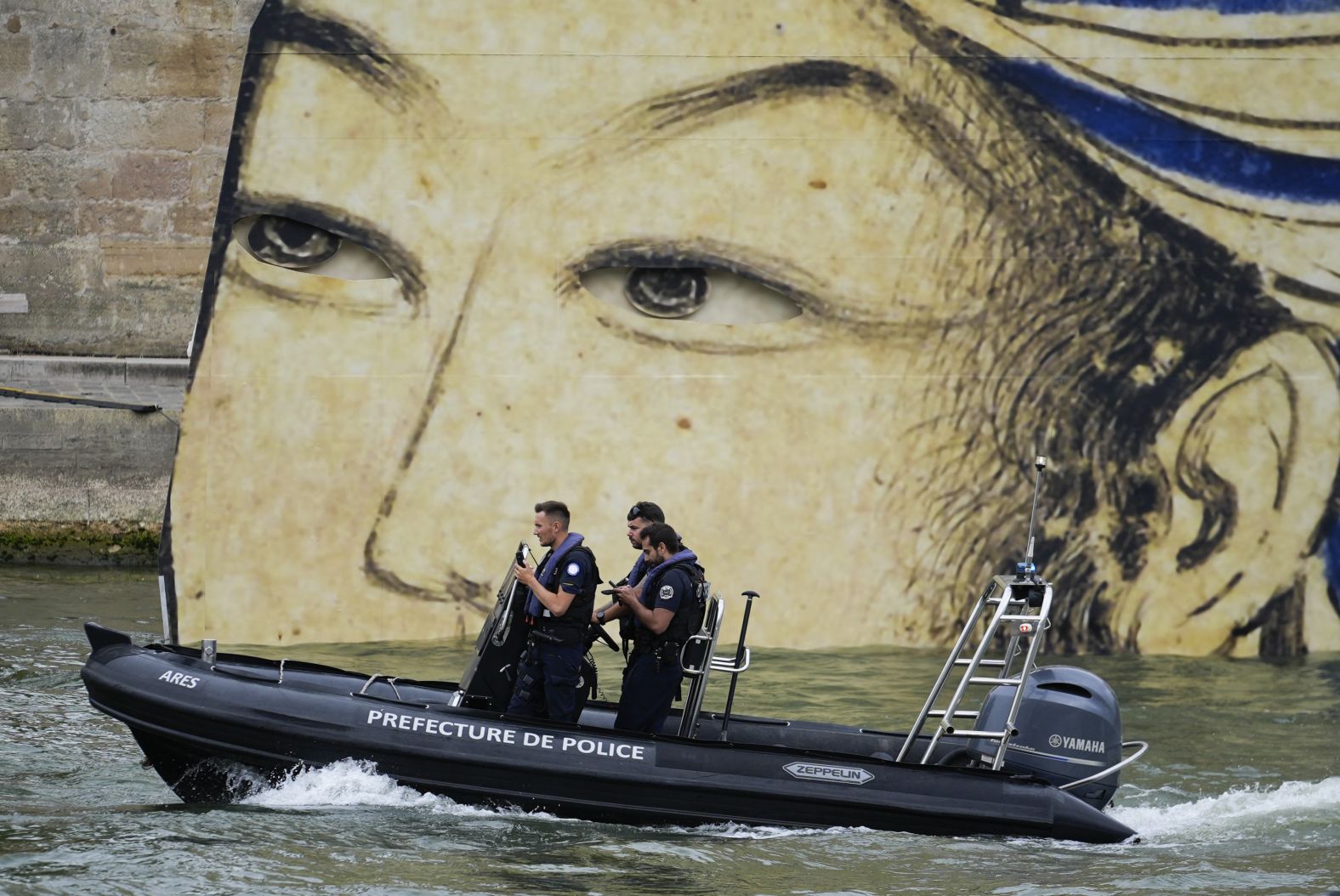 Security officers patrol Paris by boat before the start of the ceremony.