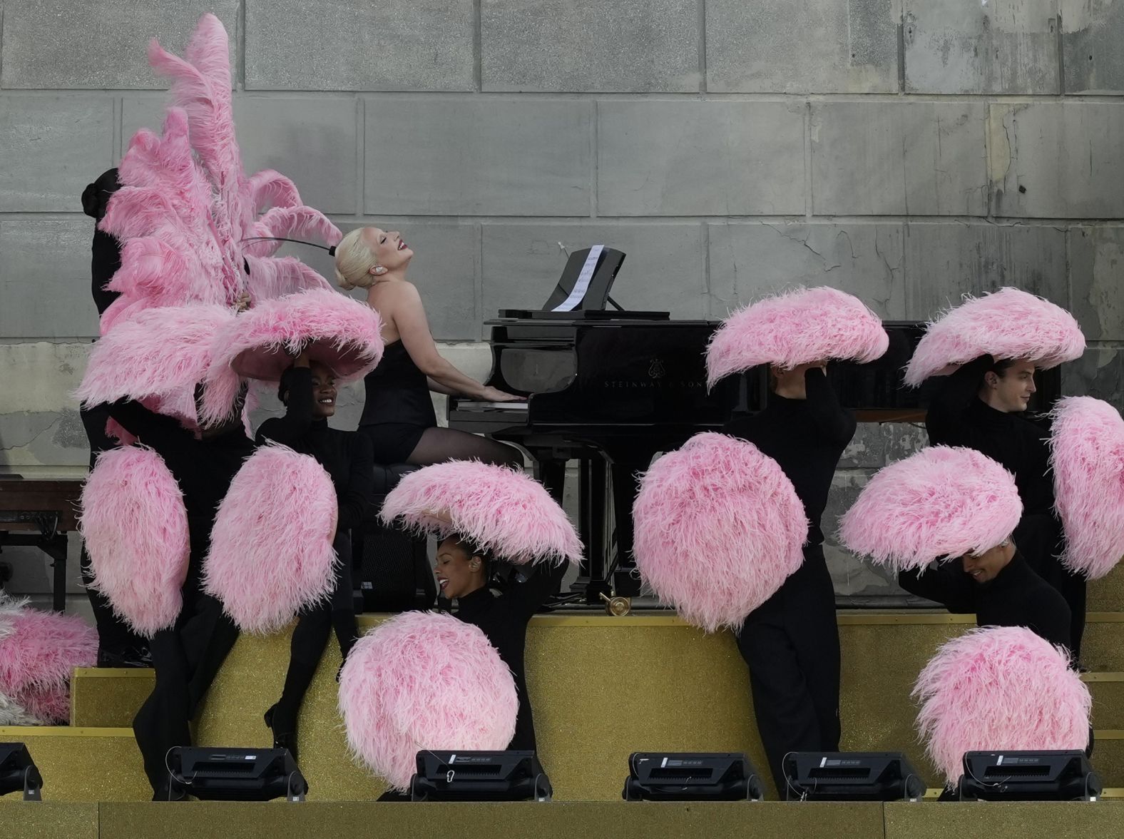 Lady Gaga performs during the ceremony. <a href="https://www.cnn.com/sport/live-news/paris-olympics-2024-opening-ceremony-seine#h_8fc6acef53f5652399ccbe46b1c0fffe">She had a fresh take</a> on the song “Mon truc en plumes” by iconic French artist Zizi Jeanmaire.