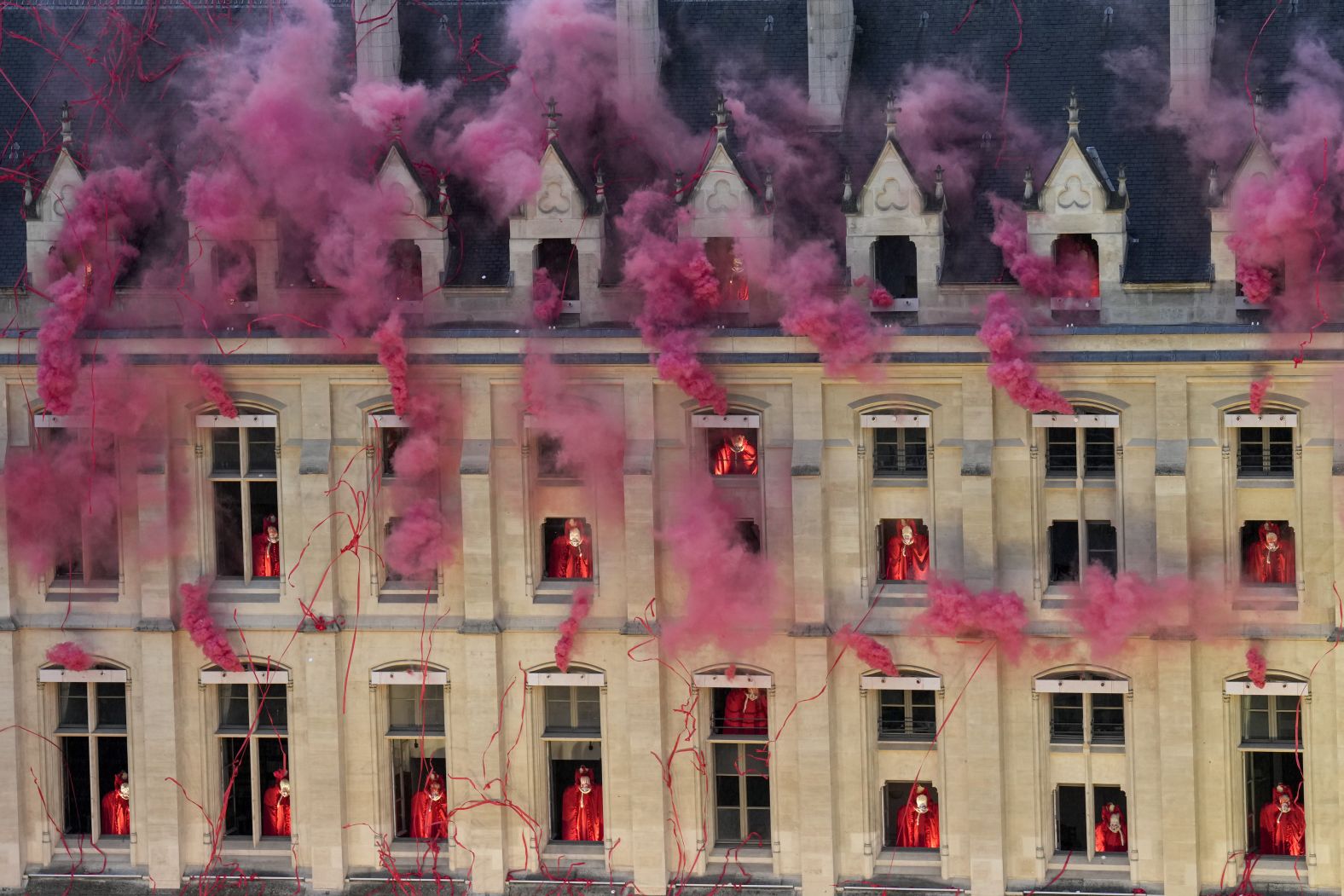 The ceremony <a href="https://www.cnn.com/sport/live-news/paris-olympics-2024-opening-ceremony-seine#h_70a19b7538b2f683ea78529e96900e99">depicted scenes from the French Revolution</a>. Here, smoke billows near windows at the Conciergerie, the site where Marie Antoinette, the last French queen prior to the revolution, was imprisoned.