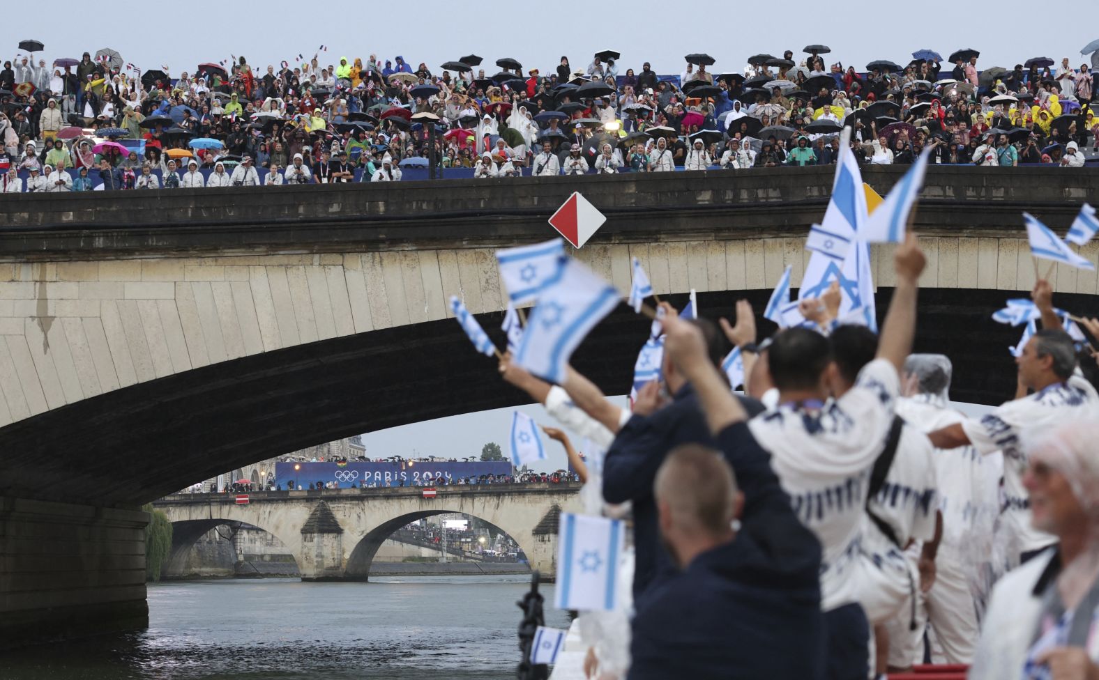 Spectators watch Israeli athletes during the Parade of Nations.