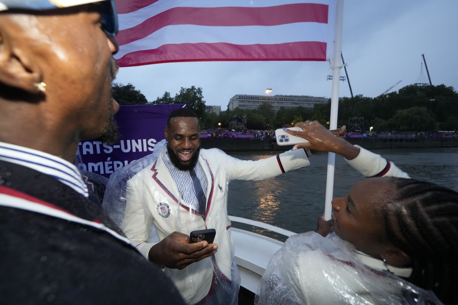 US flag bearers LeBron James and Coco Gauff travel with other American athletes during the Parade of Nations.