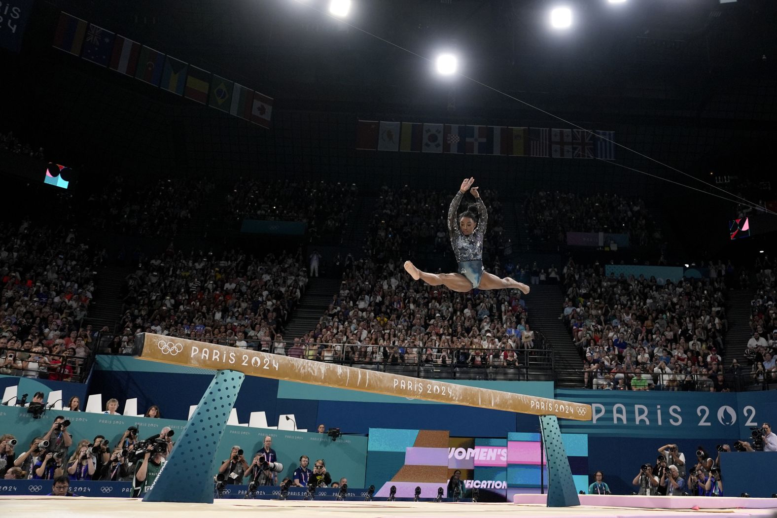 US gymnast Simone Biles competes on the balance beam during the Olympic qualification round on July 28. <a href="https://www.cnn.com/2024/07/28/sport/simone-biles-return-paris-olympics-2024-spt-intl/index.html">She landed awkwardly</a> while warming up for her floor routine, but <a href="https://www.cnn.com/2024/07/28/sport/simone-biles-return-paris-olympics-2024-spt-intl/index.html">she fought through the pain</a> to post an impressive all-around score.