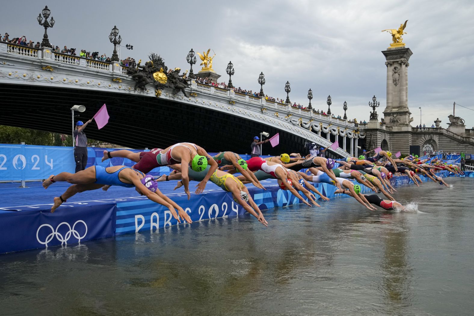 Competitors dive into the Seine River in Paris during the women's Olympic triathlon on July 31. <a href="https://www.cnn.com/2024/07/29/sport/seine-pollution-olympics-triathlon-postponed-intl-hnk/index.html">Water quality concerns</a> had postponed the men's triathlon by a day, but it was held on the same day as the women's.