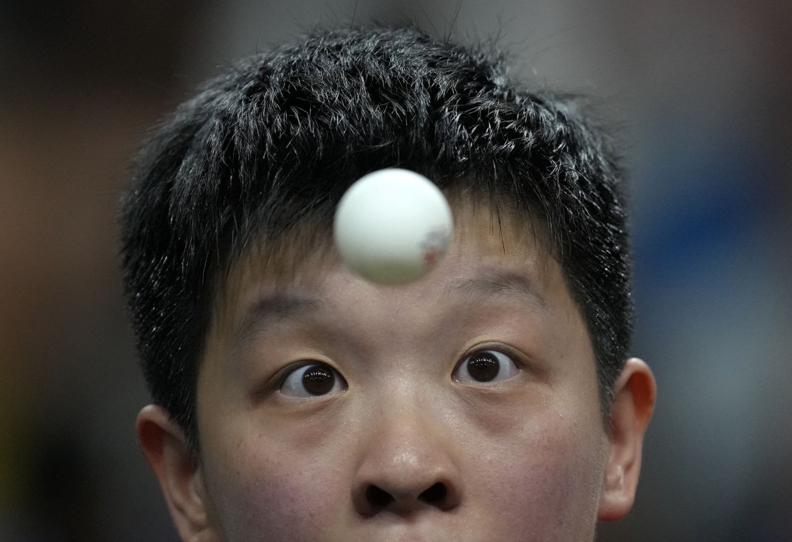 Sinagapore's Zeng Jian focuses during a table tennis match on July 31.