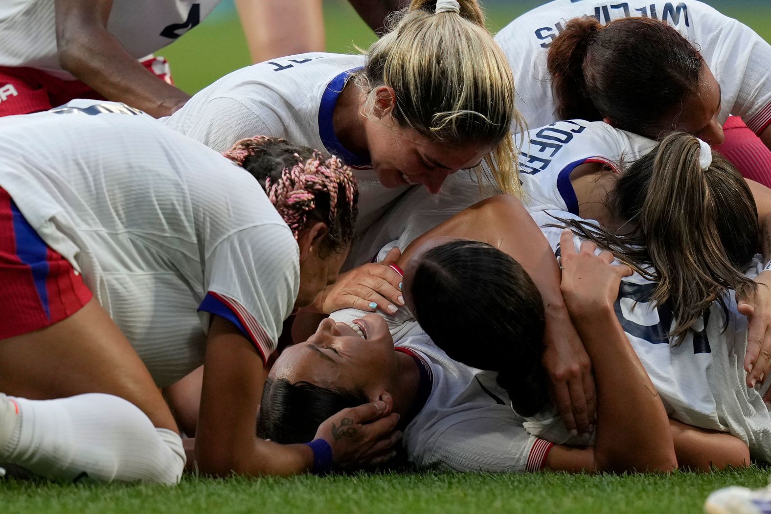 US soccer player Sophia Smith is mobbed by teammates after scoring an extra-time goal against Germany on Tuesday, August 6. The Americans won 1-0 <a href="https://www.cnn.com/sport/live-news/paris-olympics-news-2024-08-06#h_41eda3d47e1ac9b93c1db0e569023f12">to advance to the gold-medal match</a>.