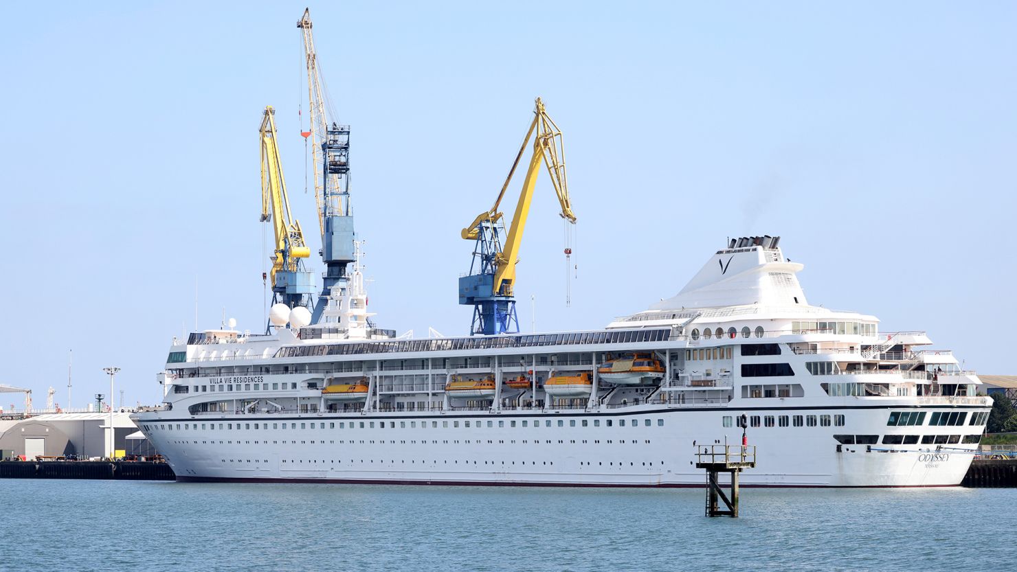 The Villa Vie Odyssey was due to leave in May, but is still in the harbor at Belfast.