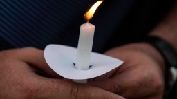 Mark Gorman holds a candle during a candlelight vigil for the slain students and teachers at Apalachee High School, on in Winder, Georgia, on September 4, 2024.