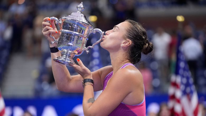 Aryna Sabalenka kisses the trophy after winning the US Open for the first time.