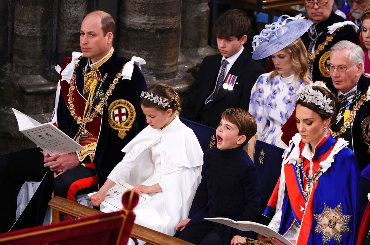 Prince Louis yawns during the ceremony.